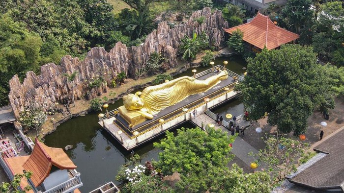 This aerial picture shows a giant Buddha statue at the Maha Vihara Mojopahit temple in Mojokerto on June 4, 2023, as Buddha devotees celebrate Vesak day. (Photo by BAGUS SARAGIH / AFP) (Photo by BAGUS SARAGIH/AFP via Getty Images)