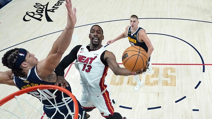 DENVER, COLORADO - JUNE 04: Bam Adebayo #13 of the Miami Heat drives to the basket against Aaron Gordon #50 of the Denver Nuggets during the second half in Game Two of the 2023 NBA Finals at Ball Arena on June 04, 2023 in Denver, Colorado. NOTE TO USER: User expressly acknowledges and agrees that, by downloading and or using this photograph, User is consenting to the terms and conditions of the Getty Images License Agreement. (Photo by Mark J. Terrill - Pool/Getty Images)
