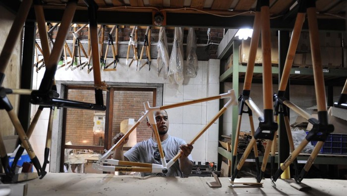 TEMANGGUNG, INDONESIA - JUNE 03 : Craftsman carry out the process of making bamboo bicycle frames at the Spedagi production house in Temanggung, Central Java, Indonesia on June 03, 2023. Spedagi Bamboo bicycles began to be developed in early 2013 and selected Petung Bamboo (Dendrocalamus asper), one of the strongest type of bamboo with a large diameter and thick walls with the construction of the âusuk bambuâ slats. The bamboo culms are then connected to special metal joints (lugs) to form a bicycle frame. The alloy of the cupped rod with oval cross-section and metal lugs results in a different frame design, but is also strong and comfortable to use. The Spedagi Bamboo Bike passed the walking test by covering a distance of 750 km, with a total load of 90 kg, without any damage, in a month the craftsmen can complete four to five bamboo bicycle frames and turn them into a bicycle. (Photo by Dasril Roszandi/Anadolu Agency via Getty Images)