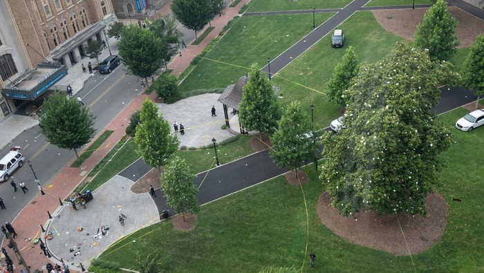Law enforcement officers investigate at the scene after a gunman opened fire in a park as high school graduates and their families emerged from a theater where commencement exercises had just concluded, in Richmond, Virginia, U.S. June 6, 2023 in this picture obtained from social media. Clark Frierson/Instagram @by.esign/via REUTERS  THIS IMAGE HAS BEEN SUPPLIED BY A THIRD PARTY. MANDATORY CREDIT.