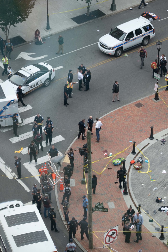 Law enforcement officers investigate at the scene after a gunman opened fire in a park as high school graduates and their families emerged from a theater where commencement exercises had just concluded, in Richmond, Virginia, U.S. June 6, 2023 in this picture obtained from social media. Clark Frierson/Instagram @by.esign/via REUTERS  THIS IMAGE HAS BEEN SUPPLIED BY A THIRD PARTY. MANDATORY CREDIT.