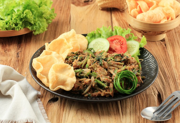 Lotek Bandung, Sundanese Traditional Healthy Salad Made from Various Boiled vegetable with Spicy Peanut Sauce. Usually Served wuth kerupuk and Eat with Steamed Rice