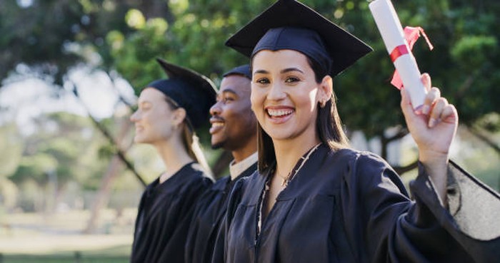Diversity, education and graduation, happy students at university ceremony in garden with certificate. School, success and woman college graduate with diploma in graduation cap celebrate with friends