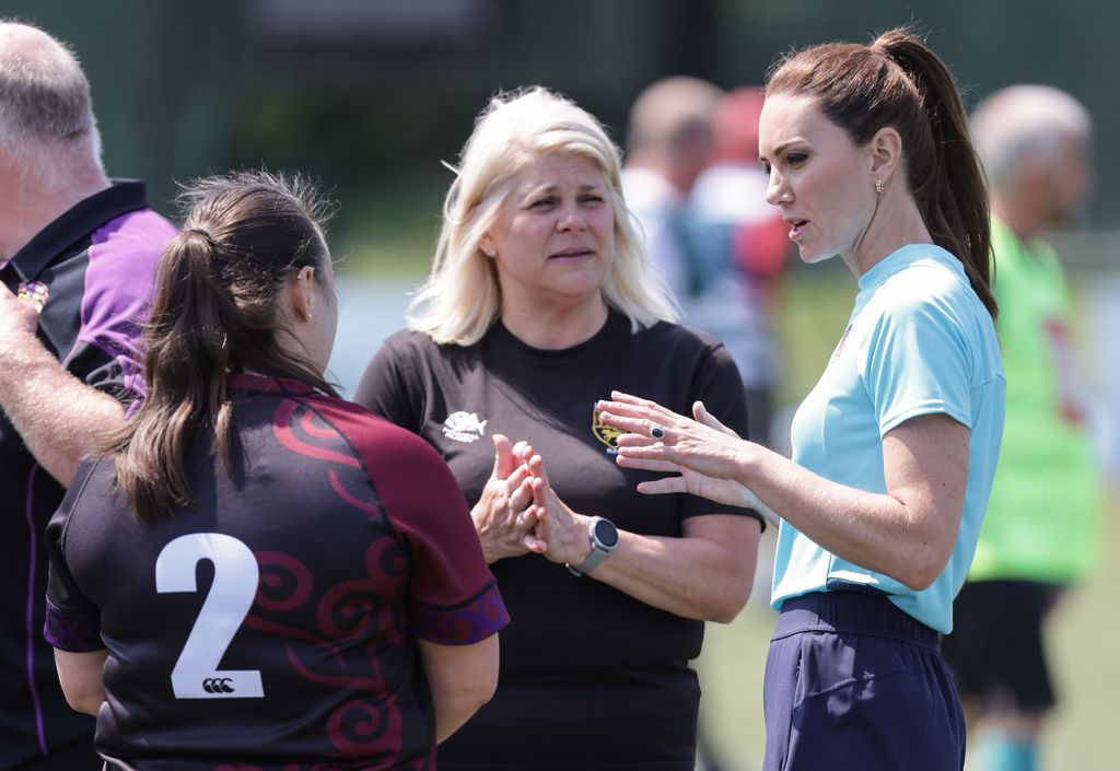 Kate Middleton Main Rubgy MAIDENHEAD, ENGLAND - JUNE 07: Catherine, Princess of Wales (R) speaks with players during her visit to Maidenhead Rugby Club on June 07, 2023 in Maidenhead, England. The Princess of Wales is visiting the rugby club to discuss the Shaping Us campaign and the role the community plays in supporting children. (Photo by Chris Jackson/Getty Images)