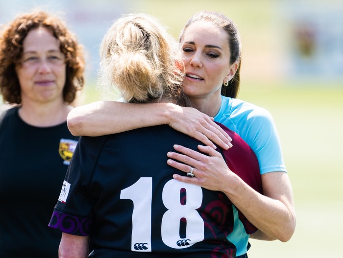 MAIDENHEAD, ENGLAND - JUNE 07:  Catherine, Princess of Wales hugs Sarah Renton during her visit to Maidenhead Rugby Club on June 07, 2023 in Maidenhead, England. The Princess of Wales is visiting the rugby club to discuss the Shaping Us campaign and the role the community plays in supporting children.  (Photo by Karwai Tang/WireImage)