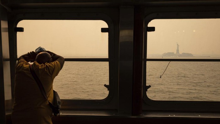 The Statue of Liberty, covered in a haze-filled sky, is photographed from the Staten Island Ferry, Wednesday, June 7, 2023, in New York. (AP Photo/Yuki Iwamura)