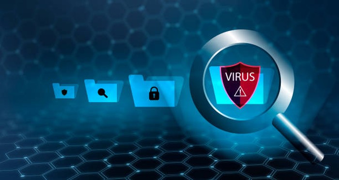 The magnifying glass is scanning for viruses in sensitive data.
