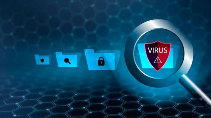 The magnifying glass is scanning for viruses in sensitive data.