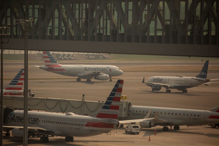 JetBlue and American Airlines planes at LaGuardia Airport (LGA) in the Queens borough of New York, US, on Thursday, June 8, 2023. The Federal Aviation Administration said LaGuardia Airport flights have now been placed under a ground delay program after being grounded due to poor visibility. Photographer: Michael Nagle/Bloomberg via Getty Images
