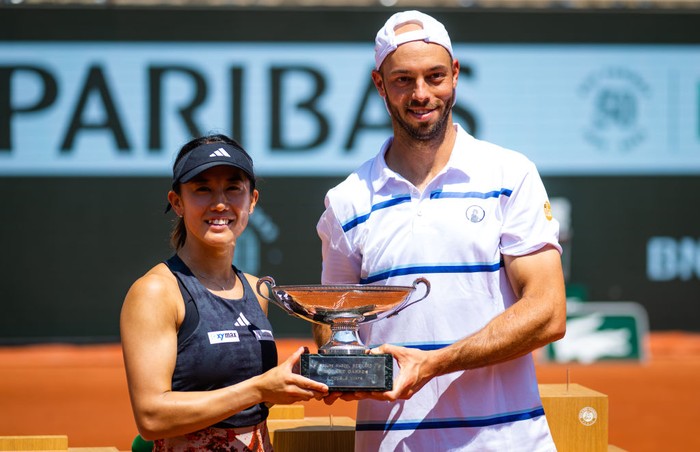 PARIS, FRANCE - JUNE 08: Miyu Kato of Japan and Tim Puetz of Germany pose with their champions trophy after defeating Bianca Andreescu of Canada and Michael Venus of New Zealand in the Mixed Doubles final on Day Twelve of Roland Garros on June 08, 2023 in Paris, France (Photo by Robert Prange/Getty Images)