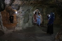 A tourist walks through a passage in the Derinkuyu underground city, in Turkeys central Nevsehir province, on August 24, 2022. - The ancient city of Elengubu, known today as Derinkuyu, reaches the depth of 85m below the Earths surface, and could accommodate up to 20,000 people. (Photo by OMAR HAJ KADOUR / AFP) (Photo by OMAR HAJ KADOUR/AFP via Getty Images)