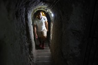A tourist walks through a passage in the Derinkuyu underground city, in Turkeys central Nevsehir province, on August 24, 2022. - The ancient city of Elengubu, known today as Derinkuyu, reaches the depth of 85m below the Earths surface, and could accommodate up to 20,000 people. (Photo by OMAR HAJ KADOUR / AFP) (Photo by OMAR HAJ KADOUR/AFP via Getty Images)