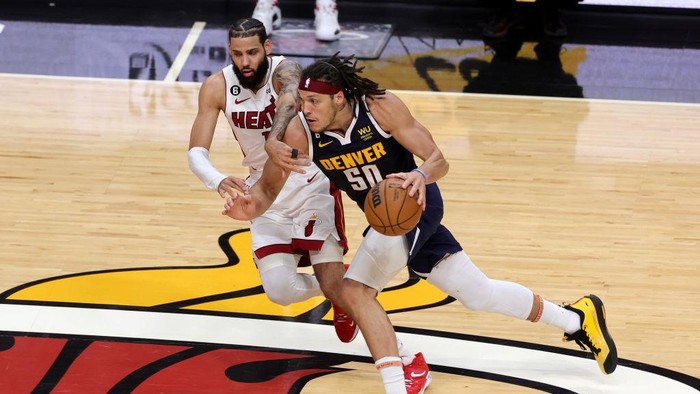 MIAMI, FLORIDA - JUNE 09: Aaron Gordon #50 of the Denver Nuggets drives against Caleb Martin #16 of the Miami Heat during the second quarter in Game Four of the 2023 NBA Finals at Kaseya Center on June 09, 2023 in Miami, Florida. NOTE TO USER: User expressly acknowledges and agrees that, by downloading and or using this photograph, User is consenting to the terms and conditions of the Getty Images License Agreement. (Photo by Megan Briggs/Getty Images)
