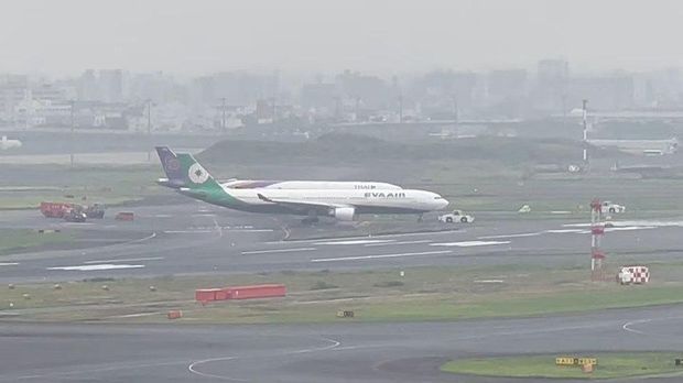 Eva Airways jet gets towed away after making contact with Thai Airways aeroplane at Haneda Airport, in Tokyo, Japan, June 10, 2023, in this screengrab taken from a social media video. Twitter@hankyu_1306F/via REUTERS