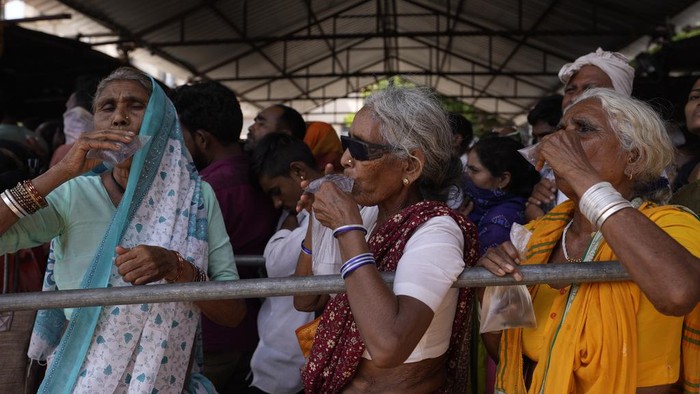 Asthma patients drink water while waiting to receive a special 