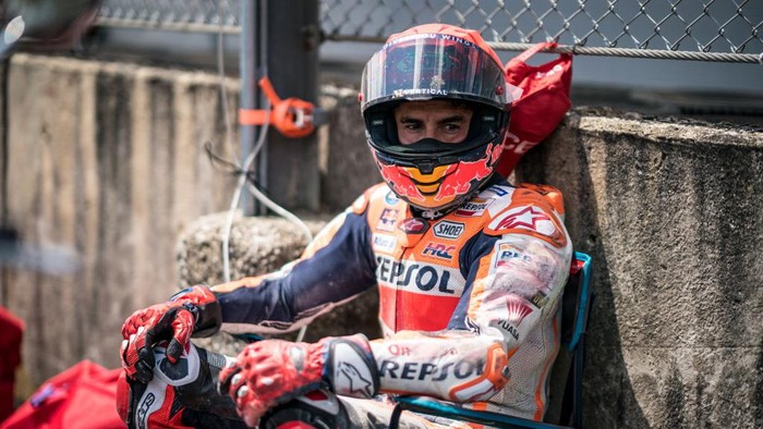 SCARPERIA, ITALY - JUNE 11: Marc Marquez of Spain and Repsol Honda Team sits in a chair after his crash next to the track marshals during the Race of the MotoGP Gran Premio dItalia Oakley at Mugello Circuit on June 11, 2023 in Scarperia, Italy. (Photo by Steve Wobser/Getty Images)