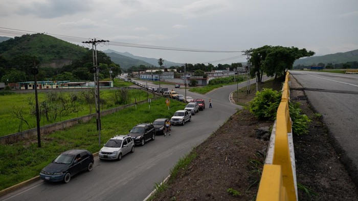 Motorists wait in line for fuel at a Petroleos de Venezuela SA (PDVSA) gas station in Maracay, Aragua state, Venezuela, on Sunday, June 11, 2023. Huge lines have reappeared outside Venezuelan gasoline stations as the oil industry rations fuel in response to technical failures at refineries. Photographer: Gaby Oraa/Bloomberg via Getty Images