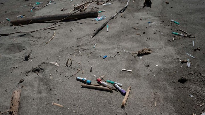 An aerial view showing garbage, including plastic waste, at Paparo Beach in Miranda State, Venezuela, on June 6, 2023. Tons of garbage that includes hospital waste, bottles and plastic containers, wood, among other materials that are collected by the Guaire and Tuy rivers in their journeys through the Venezuelan states of Miranda and Aragua, reach the beach through the mouth at Paparo beach. (Photo by Yuri CORTEZ / AFP) (Photo by YURI CORTEZ/AFP via Getty Images)