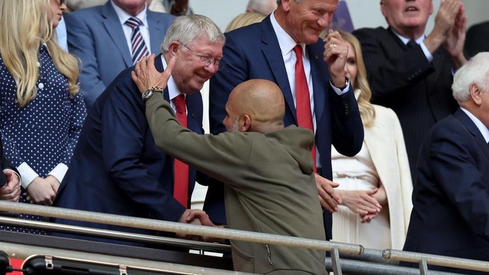 LONDON, ENGLAND - JUNE 3: Sir Alex Ferguson greets Pep Guardiola the head coach / manager of Manchester City during the Emirates FA Cup Final match between Manchester City and Manchester United at Wembley Stadium on June 03, 2023 in London, England. (Photo by James Williamson - AMA/Getty Images)