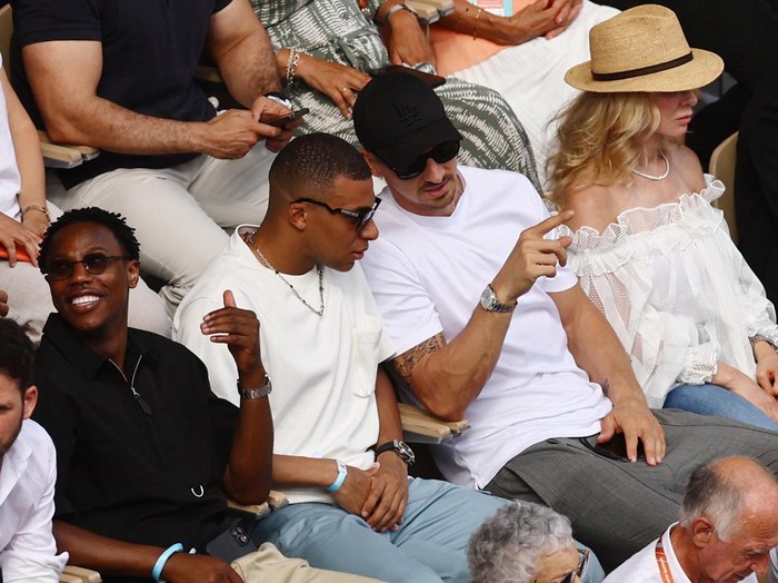Tennis - French Open - Roland Garros, Paris, France - June 11, 2023 Paris St Germain's Kylian Mbappe, former footballer Zlatan Ibrahimovic and Helena Seger, wife of Zlatan Ibrahimovic, are pictured in the stands during the men's singles final between Serbia's Novak Djokovic and Norway's Casper Ruud REUTERS/Kai Pfaffenbach