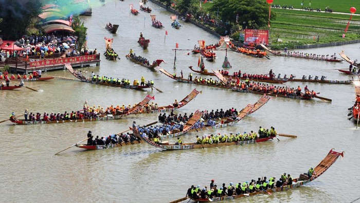 PUTIAN, CHINA - JUNE 12: Participants compete during the thousand-year-old folk custom 