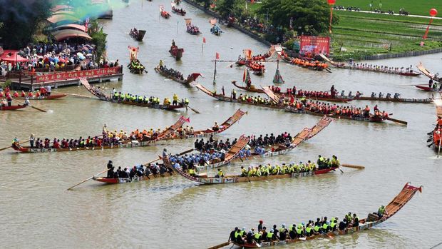 PUTIAN, CHINA - JUNE 12: Participants compete during the thousand-year-old folk custom 