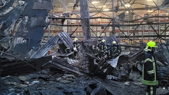 Firefighters work at a site of a food warehouse heavily damaged by a Russian missile strike, amid Russias attack on Ukraine, in Odesa, Ukraine June 14, 2023. Press Service of the the Operational Command South of the Ukrainian Armed Forces/Handout via REUTERS ATTENTION EDITORS - THIS IMAGE HAS BEEN SUPPLIED BY A THIRD PARTY.