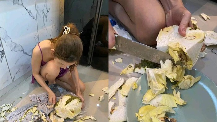Wanita ini mengupas durian dengan cara yang salah seperti mengupas kelapa