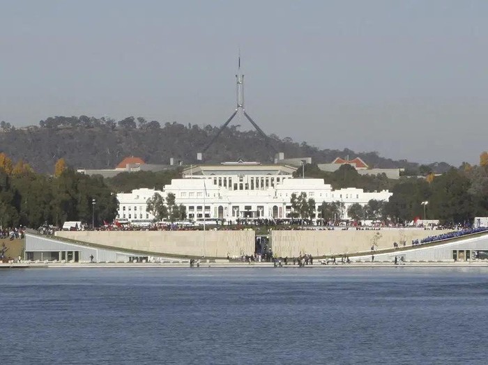FILE - Australias Parliament House sits behind Lake Burley Griffin in Canberra, Australia, Thursday, April 24, 2008. The Australian government expects to introduce legislation on Thursday, June 14, 2023, to prevent Russia from building a new embassy near Parliament House on security grounds. (AP Photo/Rob Griffith, File)