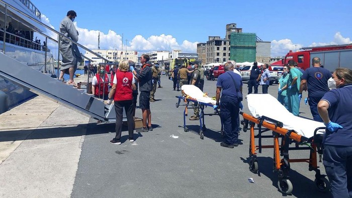 Survivors arrive by yacht after a rescue operation at the port in Kalamata town, about 240 kilometers (150miles) southwest of Athens on Wednesday, June 14, 2023. Authorities say at least 30 people have died after a fishing boat carrying dozens of migrants capsized and sank off the southern coast of Greece. A large search and rescue operation is underway. (www.argolikeseidhseis.gr via AP)