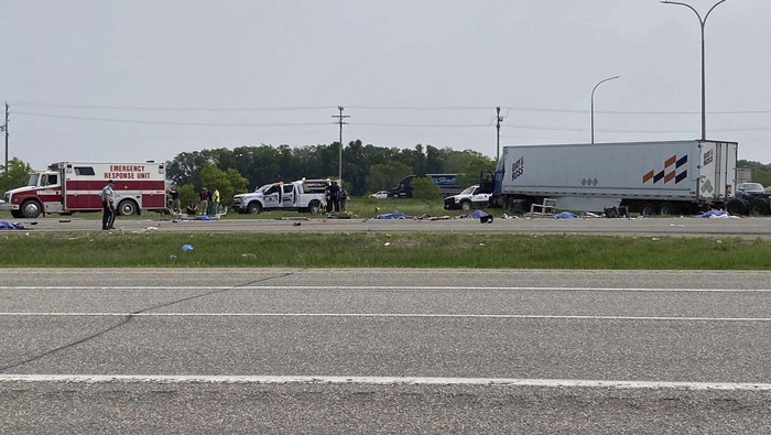 EDS NOTE: GRAPHIC CONTENT - This photo shows the scene of a major collision that has closed a section of the Trans-Canada Highway near Carberry, Manitoba on Thursday June 15, 2023. Authorities did not confirm casualties, but health officials said they were preparing a mass casualty response. (Steve Lambert/The Canadian Press via AP)