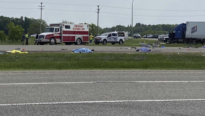 EDS NOTE: GRAPHIC CONTENT - This photo shows the scene of a major collision that has closed a section of the Trans-Canada Highway near Carberry, Manitoba  on Thursday June 15, 2023. Authorities did not confirm casualties, but health officials said they were preparing a mass casualty response. (Steve Lambert/The Canadian Press via AP)