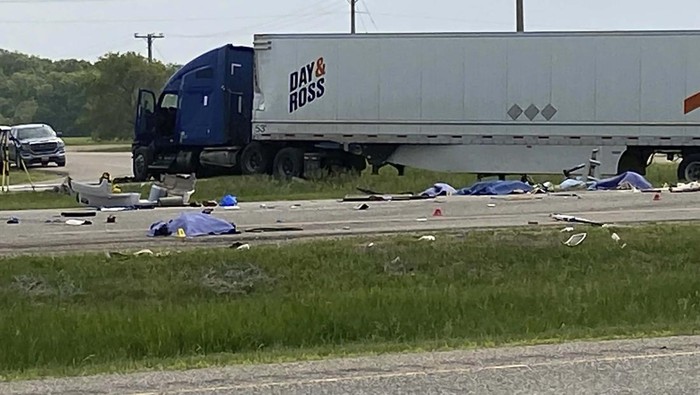 EDS NOTE: GRAPHIC CONTENT - This photo shows the scene of a major collision that has closed a section of the Trans-Canada Highway near Carberry, Manitoba  on Thursday June 15, 2023. Authorities did not confirm casualties, but health officials said they were preparing a mass casualty response. (Steve Lambert/The Canadian Press via AP)
