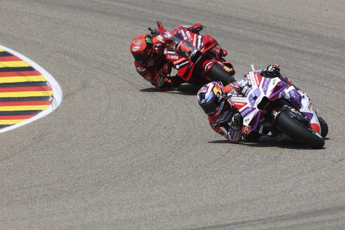 Spains Jorge Martin, of the Prima Pramac Racing team, rides his bike as he celebrates after winning the German Grand Prix, at the Sachsenring racing circuit, in Hohenstein-Ernstthal, Germany, Sunday, June 18, 2023. (Jan Woitas/dpa via AP)