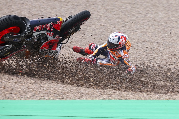 Marc Marquez from Spain on his Repsol Honda falls in the gravel during qualifying practice for the German Grand Prix at the Sachsenring in  Hohenstein-Ernstthal, Germany, Saturday, June 17, 2023. (Jan Woitas//dpa via AP)