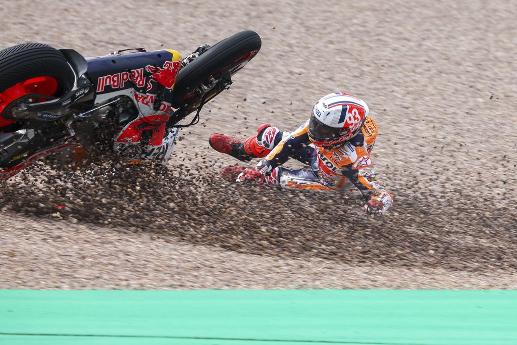 Marc Marquez from Spain on his Repsol Honda falls in the gravel during qualifying practice for the German Grand Prix at the Sachsenring in  Hohenstein-Ernstthal, Germany, Saturday, June 17, 2023. (Jan Woitas//dpa via AP)
