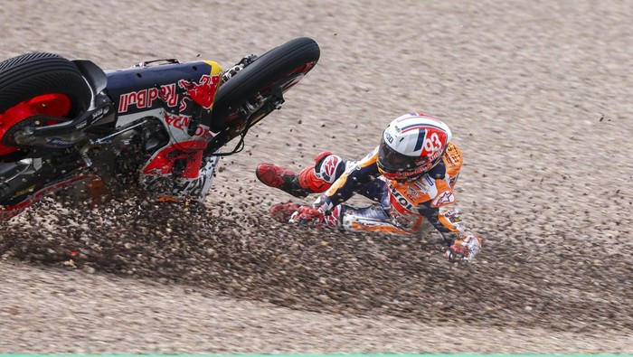 Marc Marquez from Spain on his Repsol Honda falls in the gravel during qualifying practice for the German Grand Prix at the Sachsenring in  Hohenstein-Ernstthal, Germany, Saturday, June 17, 2023. (Jan Woitas//dpa via AP)