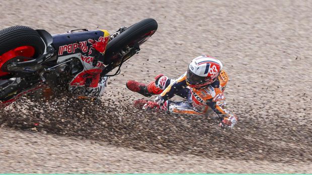 Marc Marquez from Spain on his Repsol Honda falls in the gravel during qualifying practice for the German Grand Prix at the Sachsenring in  Hohenstein-Ernstthal, Germany, Saturday, June 17, 2023. (Jan Woitas//dpa via AP)