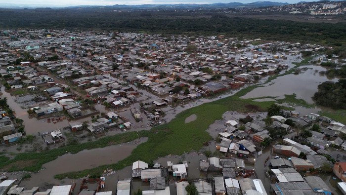 An aerial view shows damage and floods due to heavy rains after an extra-tropical cyclone, in Sao Leopoldo, Rio Grande do Sul state, Brazil June 17, 2023. REUTERS/Diego Vara