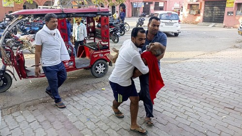 An elderly man is carried to a hospital in Ballia district, in northern Uttar Pradesh state, India, Sunday, June 18, 2023. Swaths of two of Indias most populous states are under a grip of sever heat leaving dozens of people dead in several days as authorities issue a warning to residents over 60 and others with ailments to stay indoors during the daytime. (AP Photo)