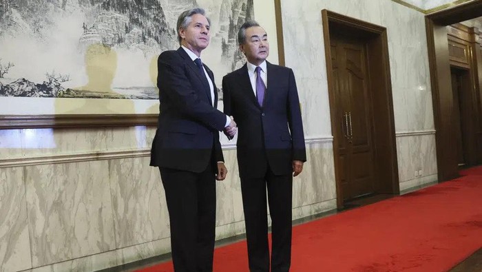 U.S. Secretary of State Antony Blinken, left, shakes hands with Chinas top diplomat Wang Yi, right, at the Diaoyutai State Guesthouse in Beijing, China, Monday, June 19, 2023. (Leah Millis/Pool Photo via AP)