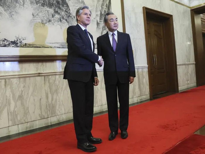 U.S. Secretary of State Antony Blinken, left, shakes hands with Chinas top diplomat Wang Yi, right, at the Diaoyutai State Guesthouse in Beijing, China, Monday, June 19, 2023. (Leah Millis/Pool Photo via AP)