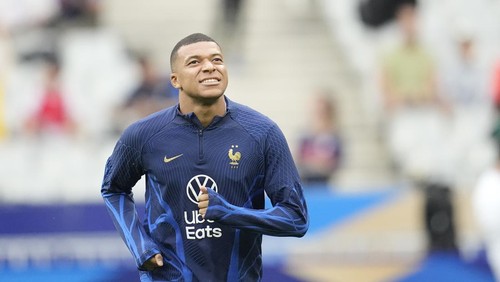 Frances Kylian Mbappe warms up before the Euro 2024 group B qualifying soccer match between France and Greece at the Stade de France, outside Paris, Monday, June 19, 2023. (AP Photo/Christophe Ena)