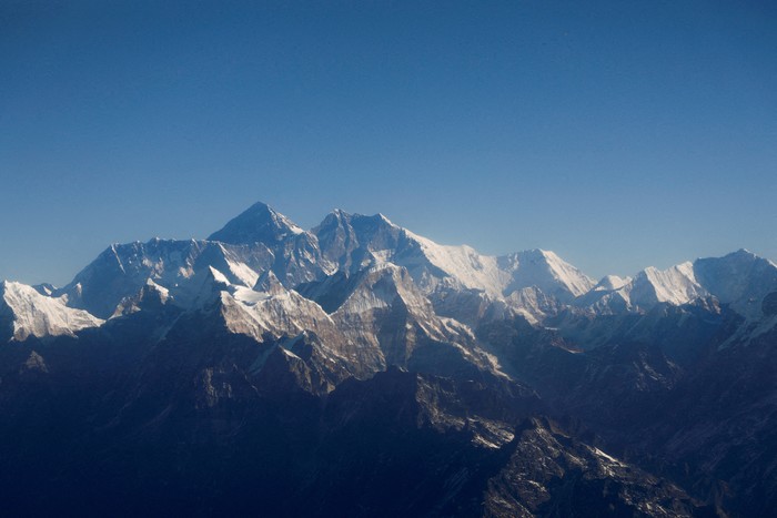 FILE PHOTO: Mount Everest, the world highest peak, and other peaks of the Himalayan range are seen through an aircraft window during a mountain flight from Kathmandu, Nepal January 15, 2020. REUTERS/Monika Deupala/File Photo