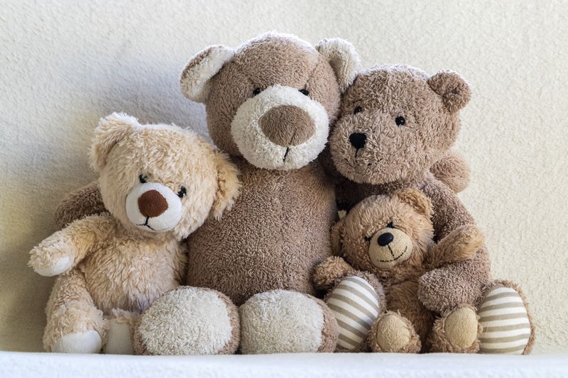 1369615949 Happy teddy bear family (parents and two children) portrait