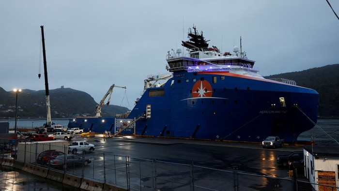 Equipment that was flown in by U.S. Air Force transport planes is loaded onto the offshore vessel Horizon Arctic, before its deployment to the search area of a missing OceanGate Expeditions submersible which had been carrying five people to explore the sunken Titanic, in the port of St. John’s, Newfoundland, Canada June 20, 2023. REUTERS/David Hiscock NO RESALES. NO ARCHIVES