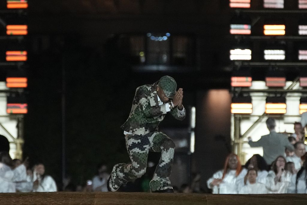 Models wear creations for Louis Vuitton as part of the Menswear Spring/Summer 2024 fashion collection presented in Paris, Tuesday, June 20, 2023. (AP Photo/Christophe Ena)