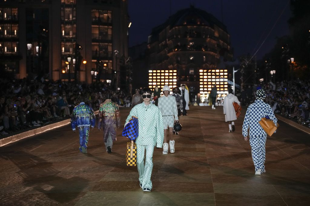 Models wear creations for Louis Vuitton as part of the Menswear Spring/Summer 2024 fashion collection presented in Paris, Tuesday, June 20, 2023. (AP Photo/Christophe Ena)
