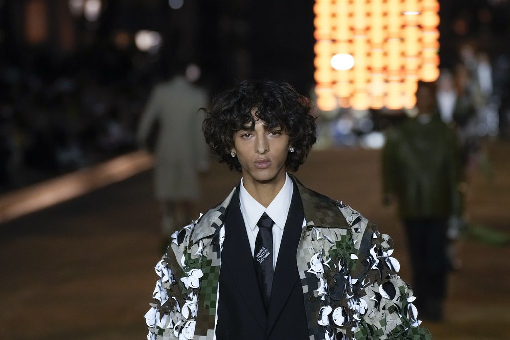 Models wear creations for Louis Vuitton as part of the Menswear Spring/Summer 2024 fashion collection presented in Paris, Tuesday, June 20, 2023. (AP Photo/Christophe Ena)