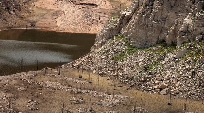 A view shows cracked ground on the Susqueda reservoir, as drinking water supplies have plunged to their lowest level since 1990 due to extreme drought, ahead of the World Day to Combat Desertification and Drought, near Girona, Spain June 16, 2023. REUTERS/Nacho Doce